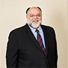 A person in a suitAI-generated content may be incorrect.